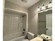Clean bathroom features tub and shower, sink with mirror and light fixtures at 4402 Poxon Ln, Monroe, NC 28110