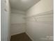 Walk-in closet with ample shelving and space for organization at 4402 Poxon Ln, Monroe, NC 28110