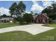 Classic brick home with a wide driveway and beautiful landscaping at 4402 Poxon Ln, Monroe, NC 28110