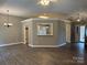 Open living area with stylish flooring and pass-through to the kitchen at 4402 Poxon Ln, Monroe, NC 28110