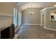 Inviting living area with fireplace, wood floors, and access to the backyard at 4402 Poxon Ln, Monroe, NC 28110