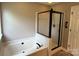 Relaxing main bathroom with soaking tub and glass enclosed shower at 4402 Poxon Ln, Monroe, NC 28110