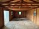Spacious interior of an outbuilding with wood framing and floor. Ready for storage or workshop use at 4402 Poxon Ln, Monroe, NC 28110
