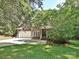 Beautiful brick home with lush lawn and landscaping, and an attached garage at 443 Hillcrest Dr, Harrisburg, NC 28075
