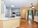A kitchen showcases a quartz countertop island, stainless steel appliances, and blue-grey cabinetry at 443 Hillcrest Dr, Harrisburg, NC 28075