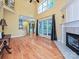 The living room features hardwood floors, fireplace, and seamless flow to the kitchen at 443 Hillcrest Dr, Harrisburg, NC 28075