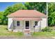 Charming bungalow featuring a welcoming porch and fenced front yard, perfect for curb appeal at 514 Jones St, Chester, SC 29706