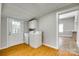 Practical laundry room with washer, dryer, storage, and convenient access to the backyard at 514 Jones St, Chester, SC 29706