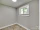 Neutral colored room with window, tile floor and white trim at 514 Jones St, Chester, SC 29706