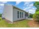 Backyard view of house featuring siding, screened porch, windows, and landscaping at 5141 Grandview Dr, Fort Mill, SC 29707