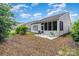 Exterior view of house from backyard, featuring screened porch and patio at 5141 Grandview Dr, Fort Mill, SC 29707