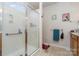 Well-lit bathroom featuring glass enclosed shower and wooden vanity at 5141 Grandview Dr, Fort Mill, SC 29707
