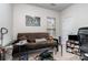 Bedroom featuring futon couch, small tables, window with blinds, and exercise equipment at 5141 Grandview Dr, Fort Mill, SC 29707