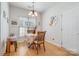 Cozy dining area featuring a round table, hardwood floors, and a bright window at 5141 Grandview Dr, Fort Mill, SC 29707