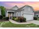 Charming single-story home with gray siding, manicured landscaping, and an attached two-car garage at 5141 Grandview Dr, Fort Mill, SC 29707