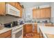 Cozy kitchen features wooden cabinets, tiled backsplash, and stainless steel appliances at 5141 Grandview Dr, Fort Mill, SC 29707