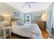 Cozy bedroom with natural light, hardwood floors, a comfortable bed, and stylish decor at 5211 Londonderry Rd, Charlotte, NC 28210