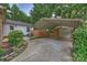 This driveway leads to a garage and a covered area at 5211 Londonderry Rd, Charlotte, NC 28210