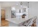 Newly remodeled kitchen with white cabinetry, stainless steel appliances, and a stylish breakfast bar with seating at 5211 Londonderry Rd, Charlotte, NC 28210