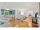 Bright living room with hardwood floors, modern furnishings and accessories, next to a separate office area at 5211 Londonderry Rd, Charlotte, NC 28210