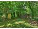 This backyard features a shed and a treed area at 5211 Londonderry Rd, Charlotte, NC 28210