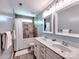 Bathroom with a double sink vanity, tile flooring, and shower-tub combination at 5797 Mcclintock Dr, Denver, NC 28037