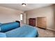 Comfortable bedroom with neutral walls and carpet features two twin beds at 5797 Mcclintock Dr, Denver, NC 28037