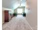 Spacious bedroom features two twin beds, a dresser, neutral carpet, and a ceiling fan at 5797 Mcclintock Dr, Denver, NC 28037