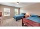 Comfortable bedroom with neutral walls and carpet features two twin beds at 5797 Mcclintock Dr, Denver, NC 28037