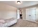 Cozy bedroom with neutral walls, carpet and a twin bed at 5797 Mcclintock Dr, Denver, NC 28037