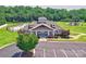Community clubhouse with well-manicured landscaping, ample parking, and inviting entrance at 5797 Mcclintock Dr, Denver, NC 28037