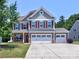 Charming two-story home with a three-car garage and well-maintained landscaping at 5797 Mcclintock Dr, Denver, NC 28037