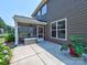 Home exterior with a screened porch, patio, and well-maintained landscaping at 5797 Mcclintock Dr, Denver, NC 28037