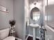 Powder room with pedestal sink, decor, and tile flooring at 5797 Mcclintock Dr, Denver, NC 28037
