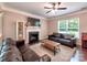 Cozy living room featuring a fireplace, neutral tones, and ample seating at 5797 Mcclintock Dr, Denver, NC 28037