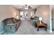 Spacious living room with neutral carpet features couches and a ceiling fan at 5797 Mcclintock Dr, Denver, NC 28037