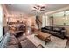 Spacious living room area with a ceiling fan, hardwood floors, sofas, and decor at 5797 Mcclintock Dr, Denver, NC 28037