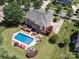 Spacious backyard with a pool, hot tub, deck, and gazebo, perfect for outdoor living at 6523 Alba Rose Ln, Huntersville, NC 28078