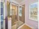 Bathroom featuring a glass-enclosed shower with tile surround at 6523 Alba Rose Ln, Huntersville, NC 28078