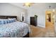 Serene bedroom with a view into another room, providing a spacious feel at 6523 Alba Rose Ln, Huntersville, NC 28078