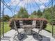 Cozy backyard gazebo with stone fire pit and seating for relaxing evenings at 6523 Alba Rose Ln, Huntersville, NC 28078