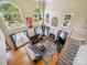 Spacious living room with fireplace, hardwood floors, and large windows for ample natural light at 6523 Alba Rose Ln, Huntersville, NC 28078