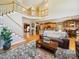 Cozy living room with wooden floors, staircase, and an open floor plan, perfect for gatherings at 6523 Alba Rose Ln, Huntersville, NC 28078