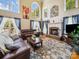 Bright living room with high ceilings, fireplace, and large windows at 6523 Alba Rose Ln, Huntersville, NC 28078