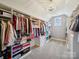 Large walk-in closet with custom shelving and ample storage space at 6523 Alba Rose Ln, Huntersville, NC 28078