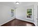 Cozy bedroom features two windows, allowing plenty of natural light, and clean, neutral walls at 745 Erin Brook Ct, York, SC 29745