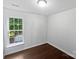 Bright bedroom with large window offers a peaceful retreat filled with natural light at 745 Erin Brook Ct, York, SC 29745