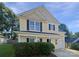 Charming two-story home with a well-maintained lawn and inviting front porch and attached garage at 745 Erin Brook Ct, York, SC 29745