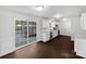 Bright kitchen features white cabinets, stainless steel appliances, and sliding glass doors leading to the backyard at 745 Erin Brook Ct, York, SC 29745