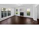 Sunlit living room features a fireplace and large windows offering inviting and stylish comfort at 745 Erin Brook Ct, York, SC 29745
